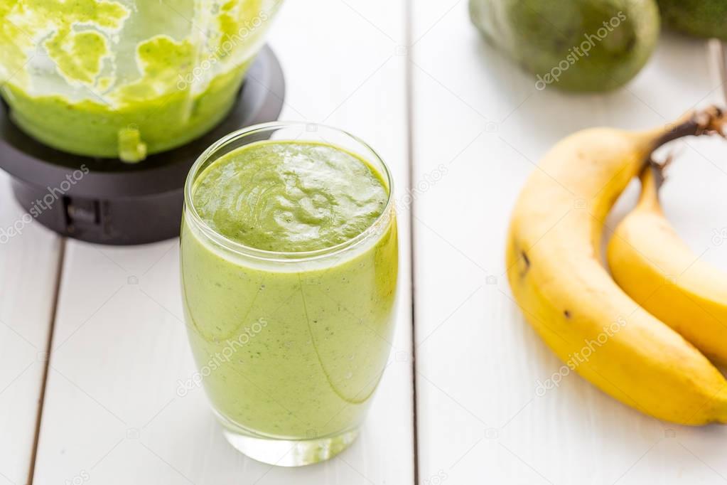 Absolutely Amazing Tasty Green Avocado Shake or Smoothie, Made with Fresh Avocados, Banana, Lemon Juice and Non Dairy Milk (Almond or Coconut) on Light White Wooden Background, Raw Food, Vegan Drink, Vegan Food Conception