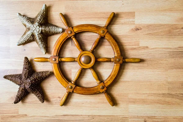 nautical background with wooden handwheel