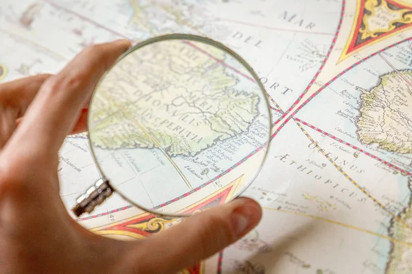 magnifier glass and map