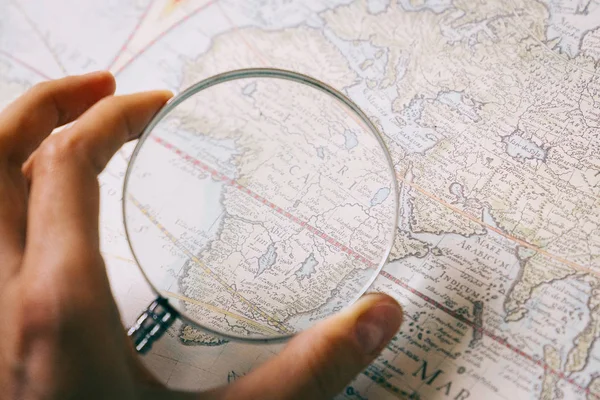 magnifier glass and map