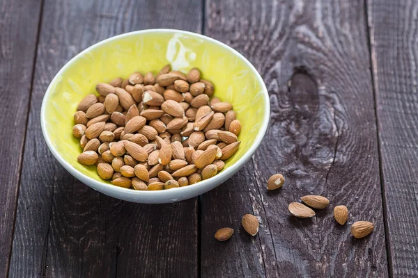 Almonds in Yellow Bowl — Stock Photo, Image