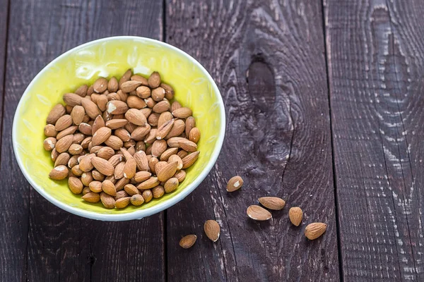 Almonds in Yellow Bowl — Stock Photo, Image