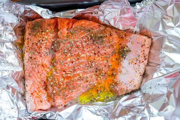 uncooked salmon slice on piece of foil