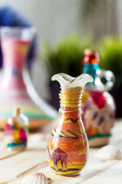 Dekoratív üveg palackok szines homok — Stock Fotó