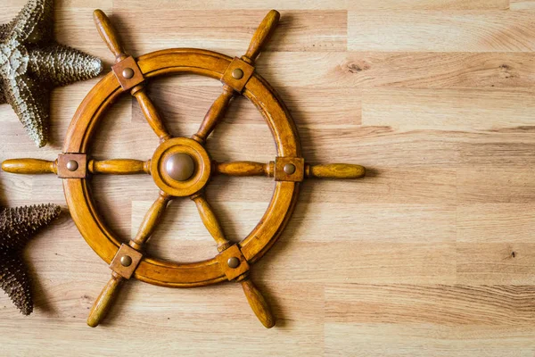 nautical background with wooden handwheel