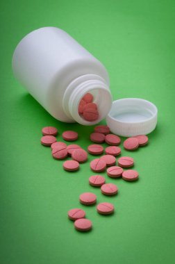 Tıbbi uygulamalarda, broşürlerde, sunumlarda ve yayınlarda grafik tasarımında kullanılacak renk haplarının arka planı. pembe renk