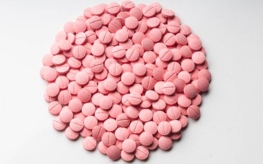 Tıbbi uygulamalarda, broşürlerde, sunumlarda ve yayınlarda grafik tasarımında kullanılacak renk haplarının arka planı. pembe renk