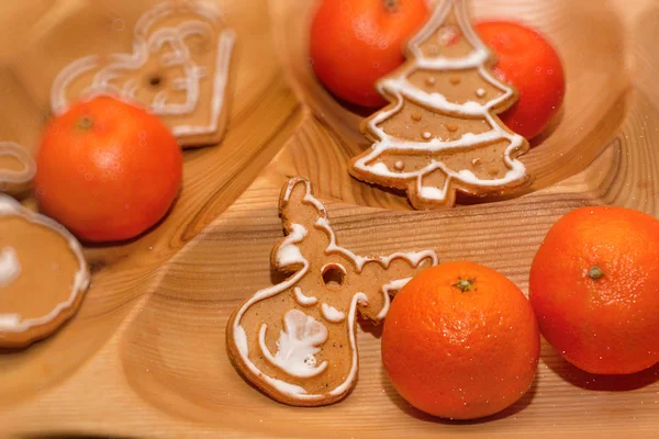 Christmas cookies and tangerines — Stock Photo, Image