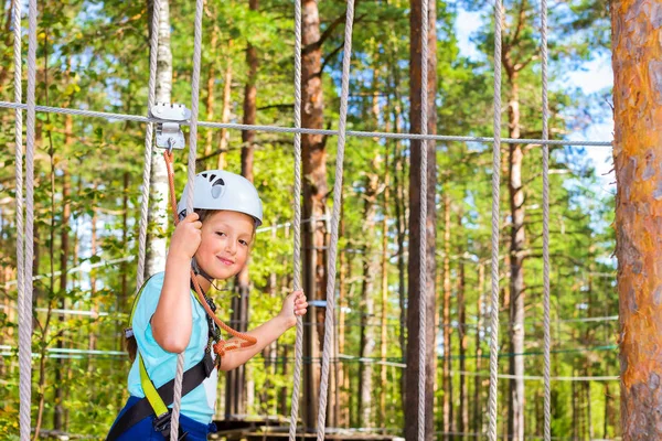 Girl on hinged trail in extreme rope Park