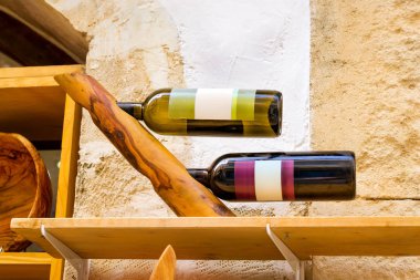 Wooden holder with bottles of Greek wine, Crete clipart