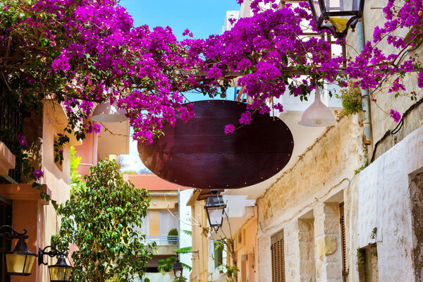 Advertising signboard on touristic street Rethymno