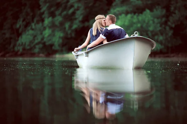 Tender couple kissing on the boat — Stock Photo, Image