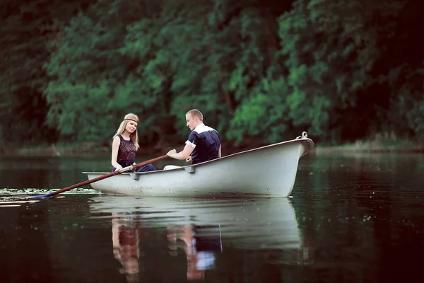 Tender couple boating on river — Stock Photo, Image
