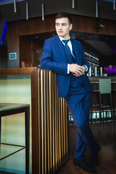 Asian groom waiting for his bride in a bar