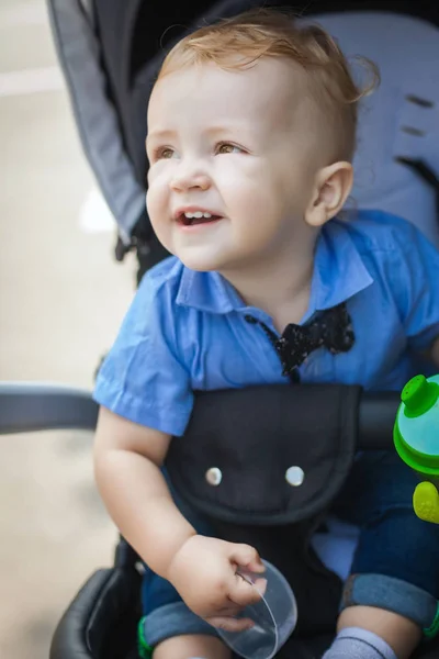 Beautiful boy in pram — Stock Photo, Image