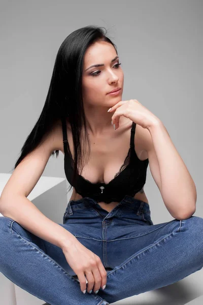 Model sitting in lotus pose in studio — Stock Photo, Image