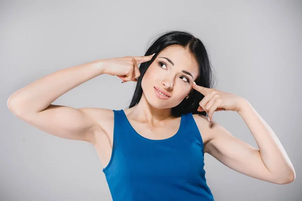 Young thoughtfull girl in studio — Stock Photo, Image