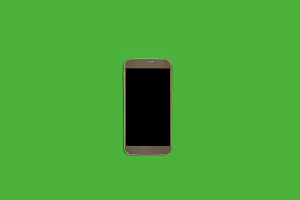 緑の背景にスマートフォンがあり — ストック写真