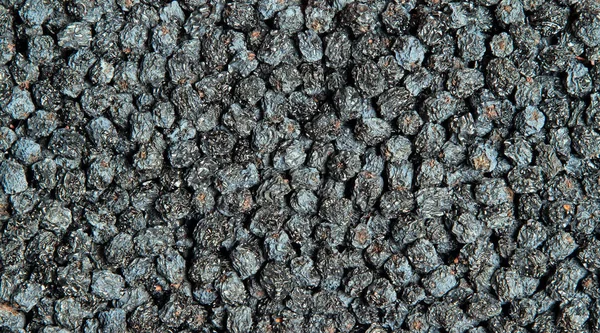 Textuur van gedroogde zwarte aronia bessen — Stockfoto