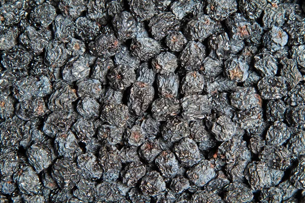 Textur der getrockneten schwarzen Aronia-Beeren — Stockfoto