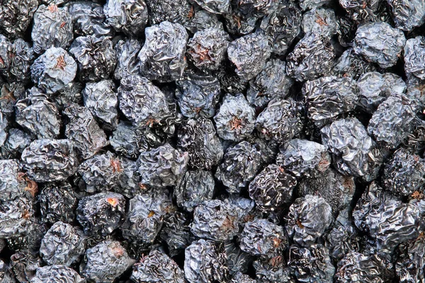Textuur van gedroogde zwarte aronia bessen — Stockfoto