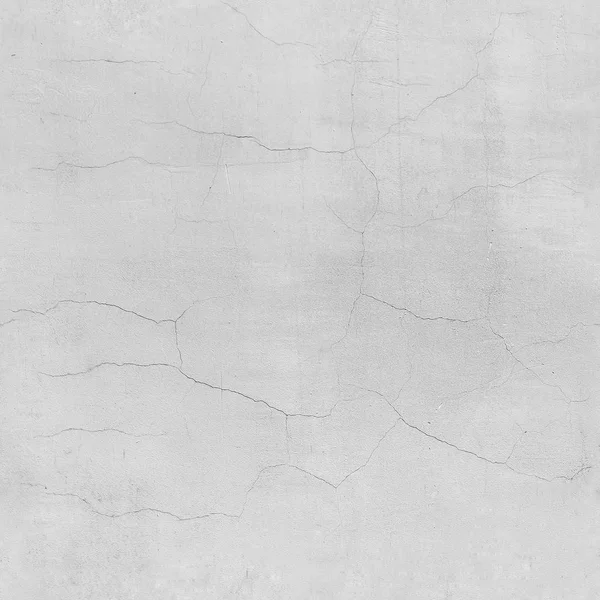 White cracked wall seamless texture. White plastered rough wall with cracks.