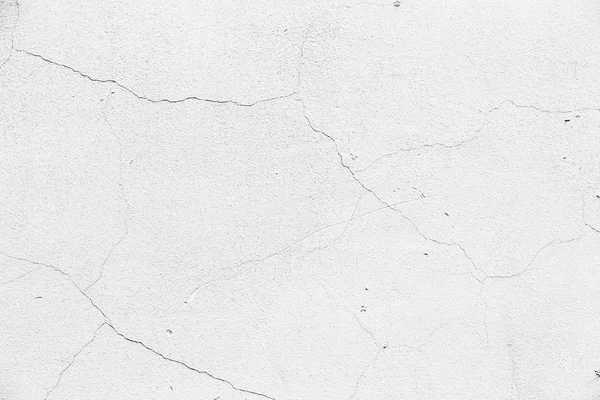 White cracked wall texture. White plastered rough wall with cracks.
