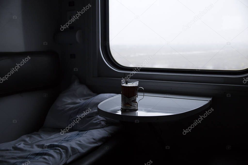 Tea cup in a train compartment