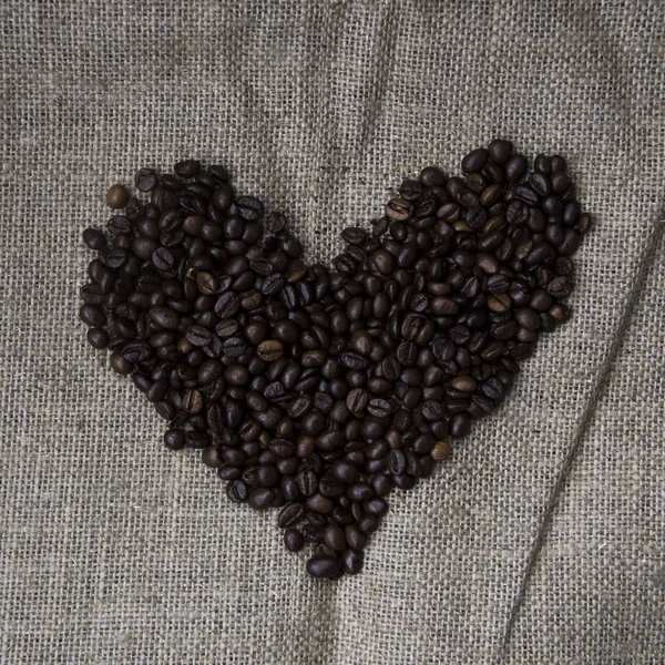 Coffee on burlap background - love on Valentine 's Day — стоковое фото