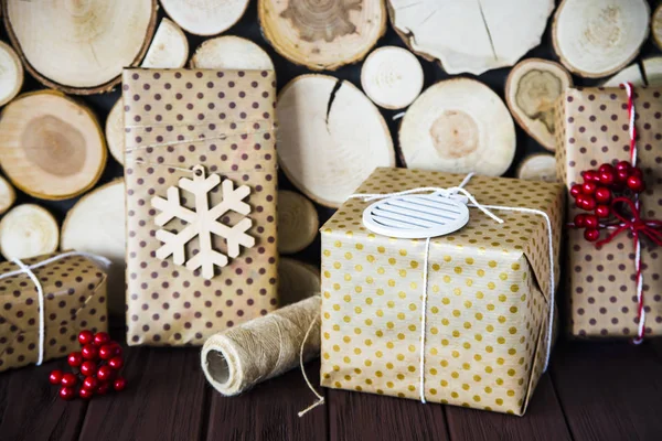 Brown dottedboxes with gifts for winter holidays — Stock Photo, Image