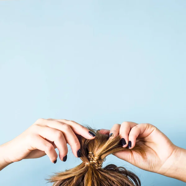 Woman Straightens Disheveled Bun Her Head Her Hands Black Manicure — Stock Photo, Image