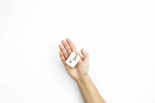 Female Hand Holds Small White Gift Minimalist Style White Background — Stock Photo, Image