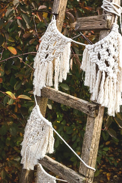 White macrame on a rough old staircase in the garden. Royalty Free Stock Images