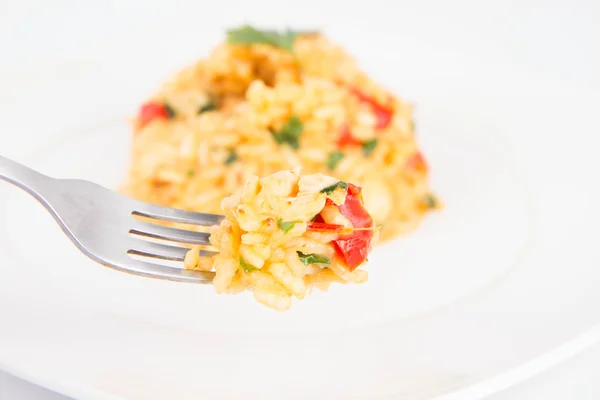 Risotto comido com um garfo — Fotografia de Stock