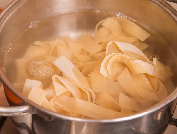 Pasta being cooked — Stock Photo, Image