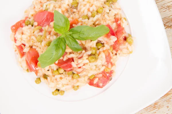 Risotto with tomato and pea — Stock Photo, Image