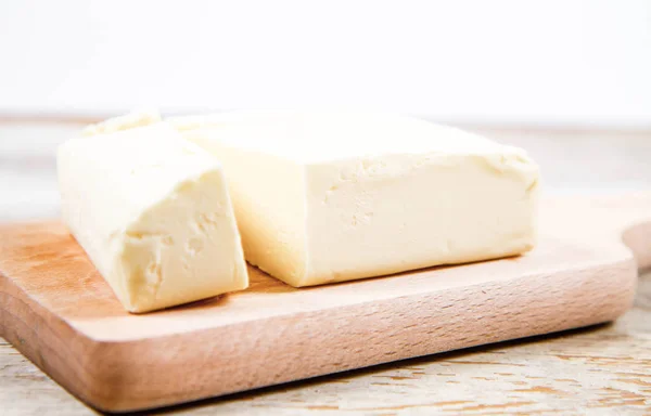 Butter on a wooden chopping board — Stock Photo, Image