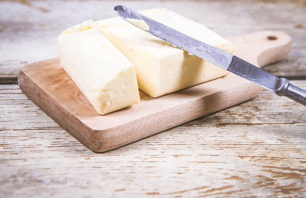 Butter on a wooden chopping board 