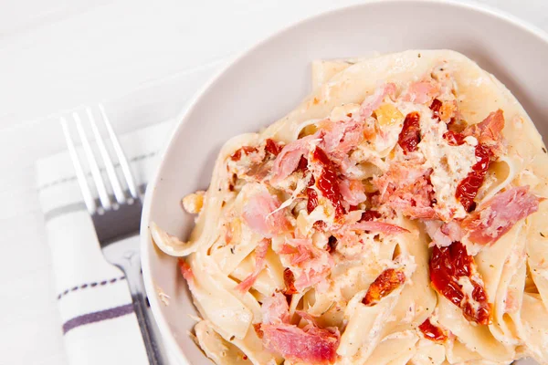 Pasta with cream sauce — Stock Photo, Image