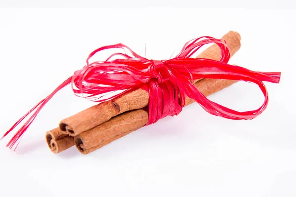Cinnamon Sticks Tied Red Ribbon White Background — 스톡 사진