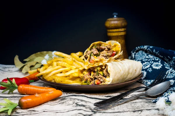 beef tacos served with golden French fries