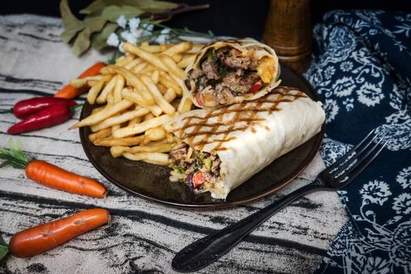 beef tacos served with golden French fries