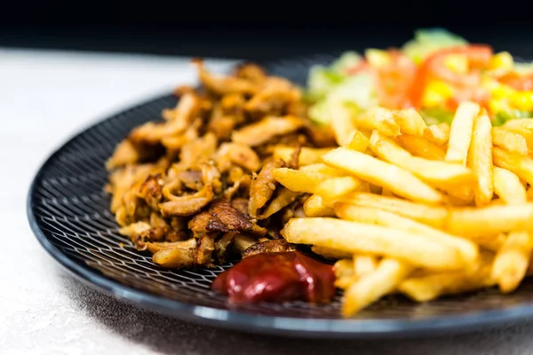 Fresh chicken with tomatoes and french fries