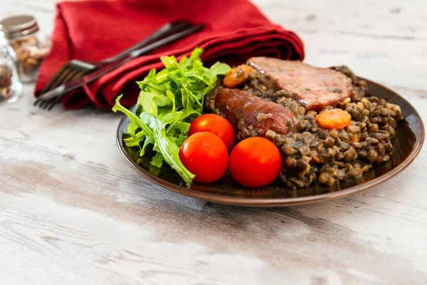 Green lentils with smoked pork sausage smoked choice, carrots and onions