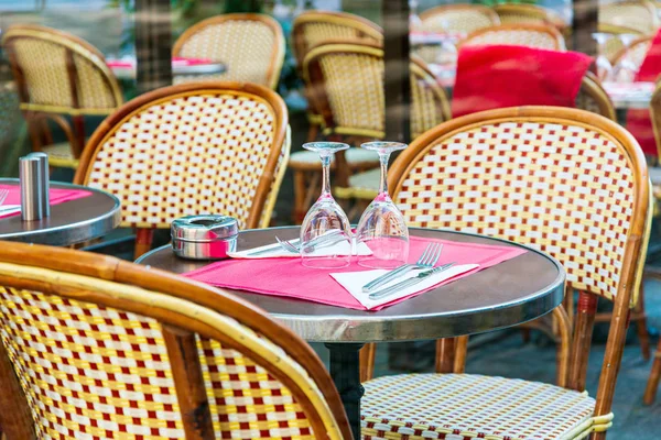 Street view of a coffee terrace with tables and chairs in europe