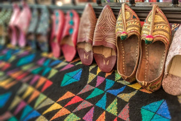 Arab slippers on a colorful carpet — Stock Photo, Image