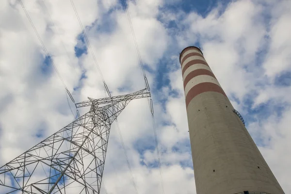 High voltage lines and chimney — ストック写真