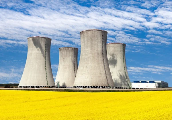 Nuclear power plant with rapeseed field — Stock Photo, Image