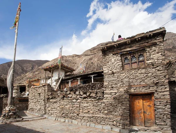 View of local stony building and stupa with prayer flags — Stock Photo, Image