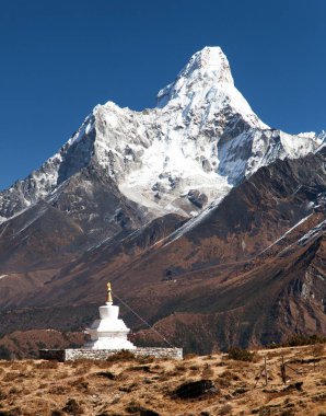 Mount Ama Dablam with stupa near Pangboche village clipart
